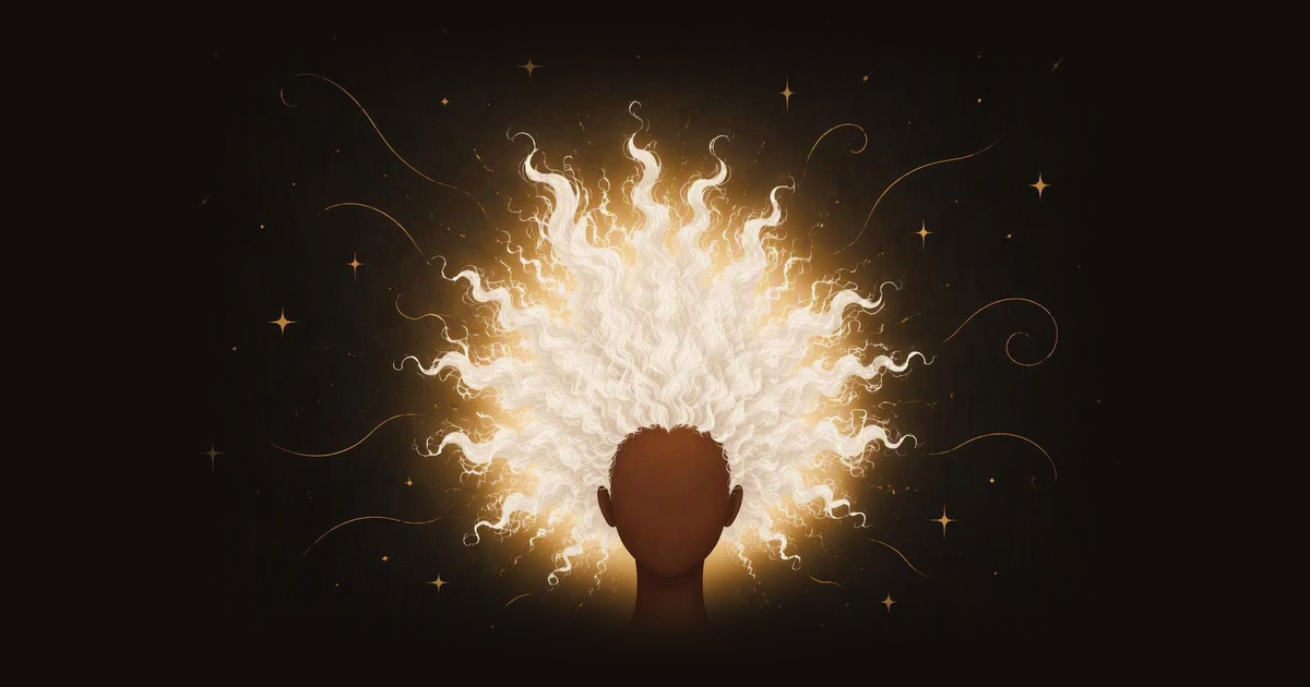 A big, bright white cloud of hair shooting out in every direction with a golden glow, seen from behind